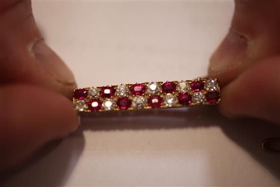 A 1940s/1950s gold, ruby and diamond bar brooch, 1.25in.